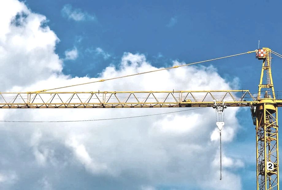 Used tower crane under blue sky